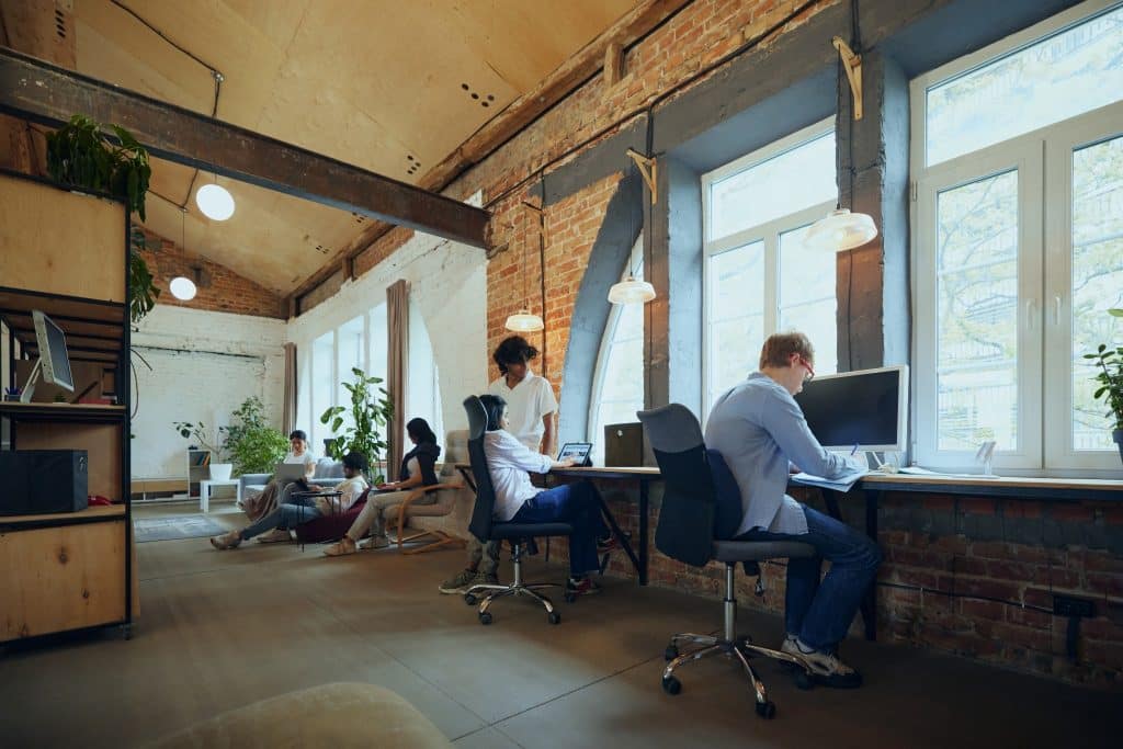 Co working space discussing digital nomad workspace comparison