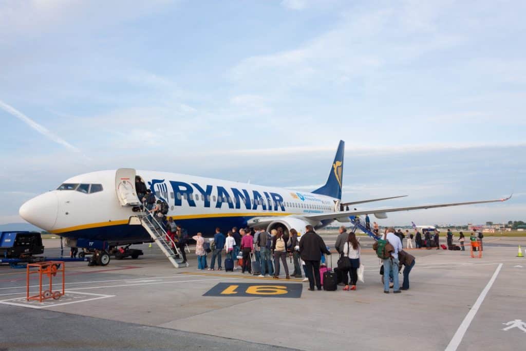 Passengers boarding a Ryanair aircraft, a popular choice for cheap last-minute flight options.
