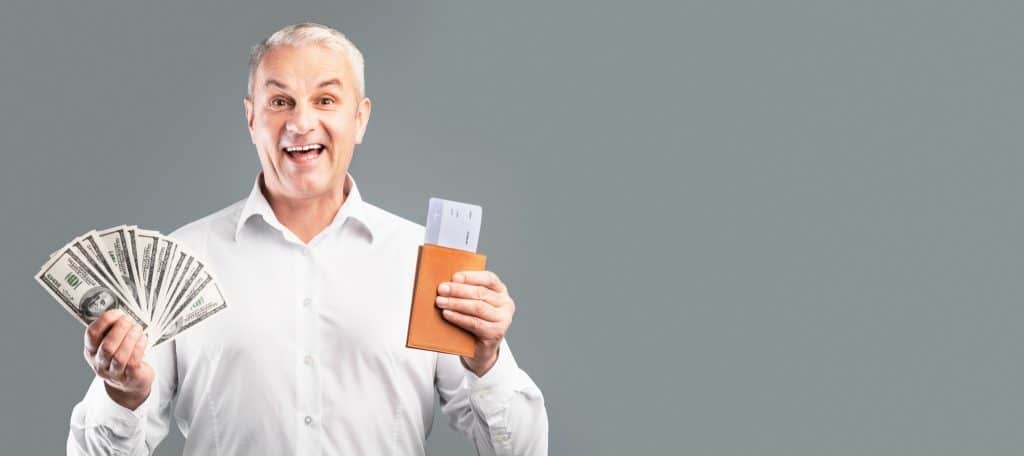 Happy traveler excited about saving money with a cheap last-minute flight deal.