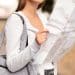 Tourist checking a city map while a pickpocket reaches into her bag, a reminder to stay alert and avoid tourist scams when exploring new places.
