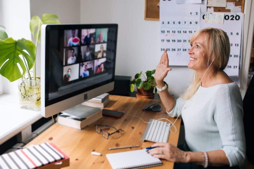 Remote worker on a video call at home office — perfect representation of a daily routine freelancer setup.