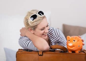 Happy traveler starting her travel with a free hotel room a rewarding outcome of smart hotel points tips.