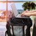 Traveler using portable office gear at airport.