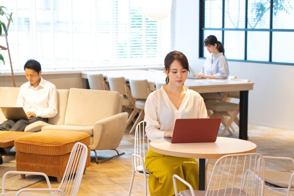 Calm coworking space with everyone having portable office gear.