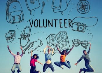 Group of travelers excited about volunteer travel programs.