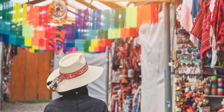 Traveler exploring colorful South American market on a budget