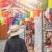 Traveler exploring colorful South American market on a budget