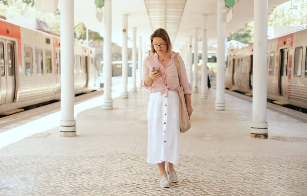 Solo traveler checking tickets on phone on free museum days europe
