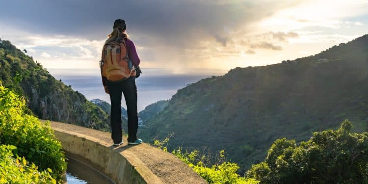 Traveler enjoying ocean view on Madeira levada walks