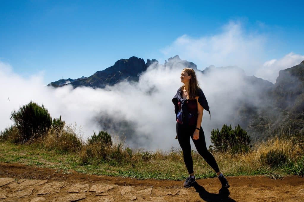 Woman standing on mountain trail during Madeira levada walks