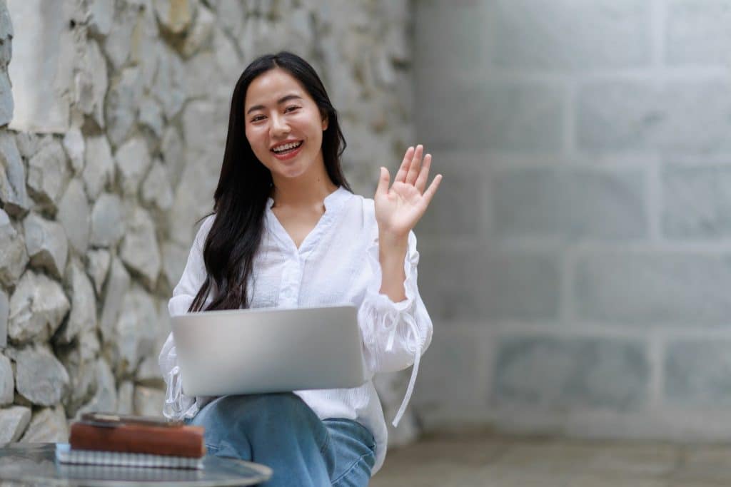 Digital nomad smiling during online meeting spain digital nomad visa requirements