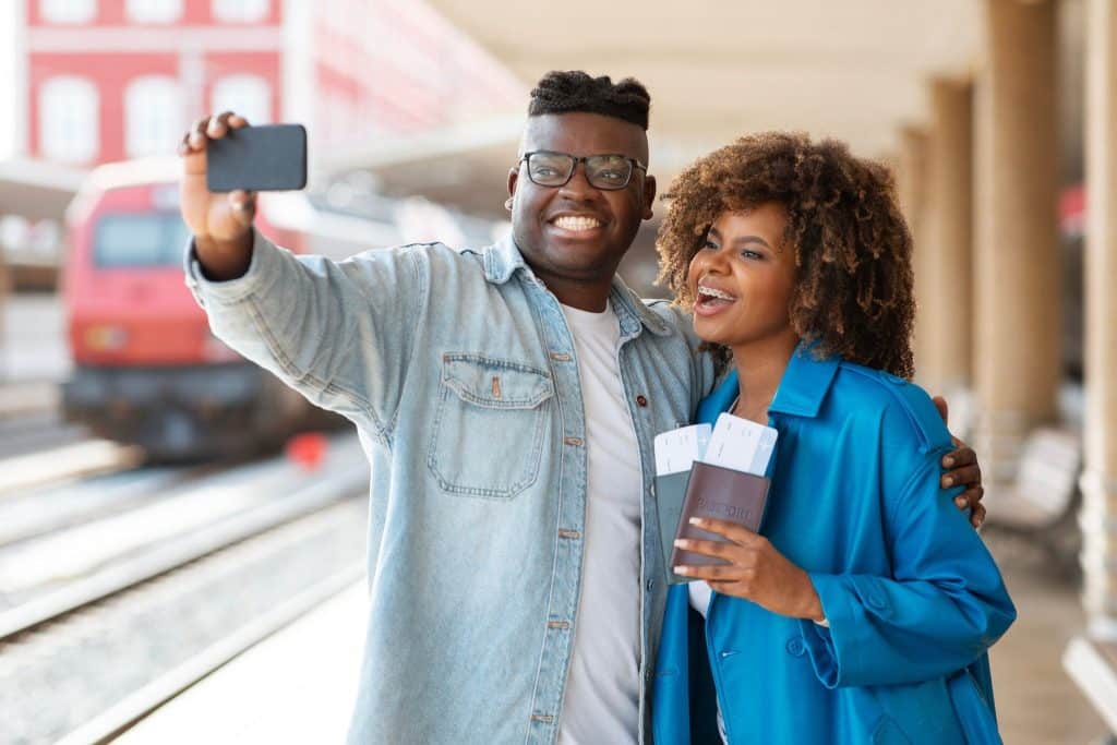 Happy travelers using split ticketing trains